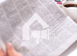 Graphic of megaphone on top of a newspaper