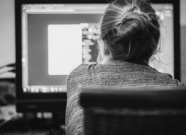 Photo of a woman working at a computer